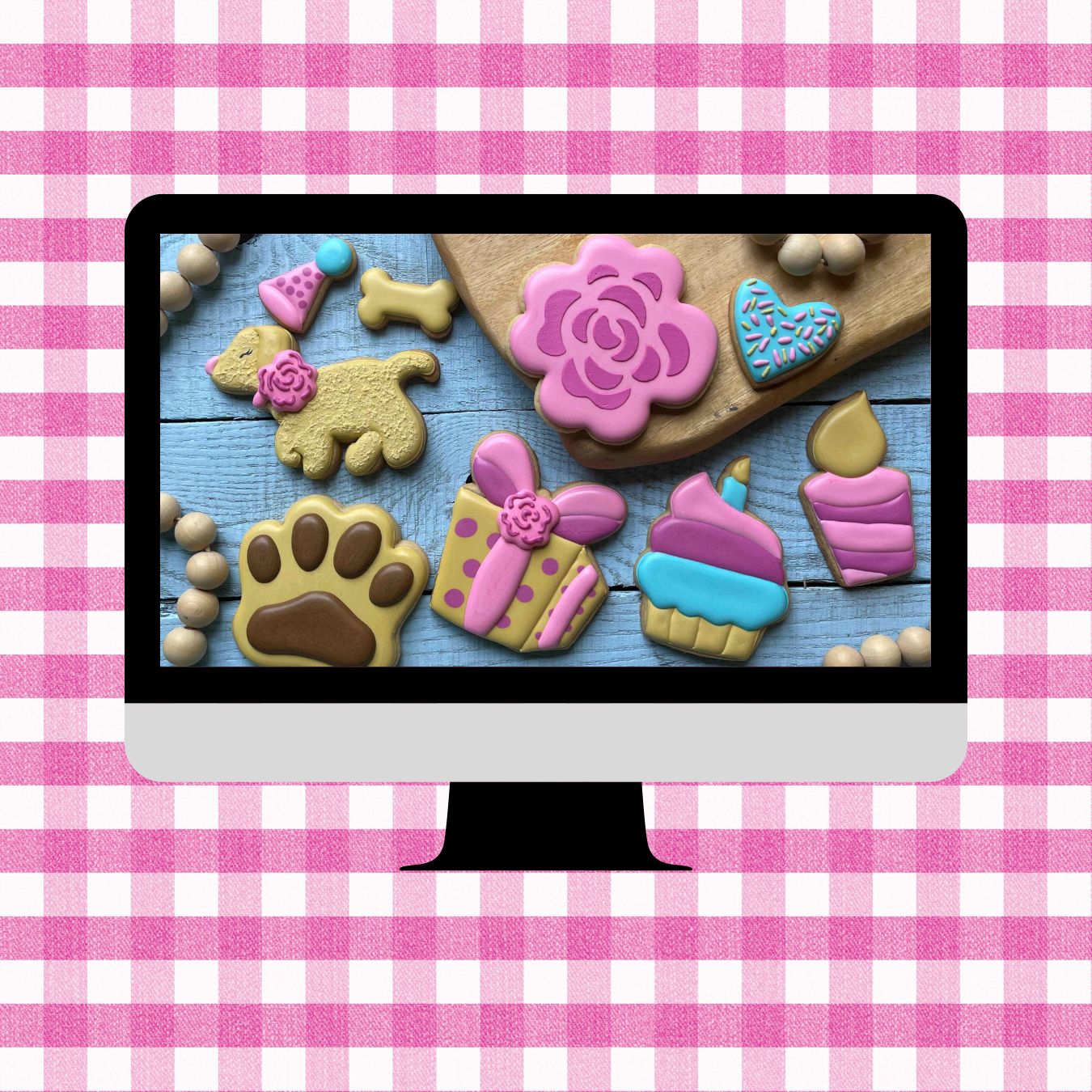 Computer screen displaying colorful cookie cutters on a pink and white checkered background