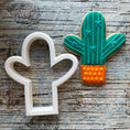 Load image into Gallery viewer, Finished Cookie cutter set  containing 1 llama cutter, 2 different cactus cookies, 1 boho rainbow, 1 feather and 1 boho mountain.
